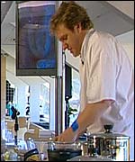 Chef demonstrating recipes to footballers' wives