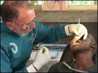 Masai chid receiving dental treatment