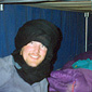 Wrapped up against the cold with his friend Catherine in their hut at Tamarrasset, southern Algeria
