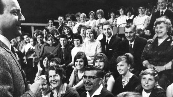 1960s TV audience laughing