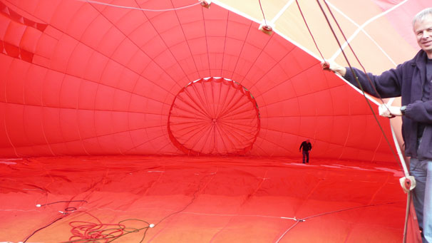 John Inglis of Keith recently took a hot air balloon trip out of Castle Fraser, Aberdeenshire. He says, "I am holding the balloon open while the pilot does his pre-flight inspection. Good experience."