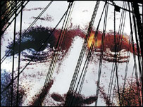 Face behind mast of ship