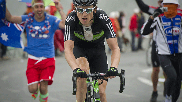 Geraint Thomas is supported by fans on a climb in the Tour de France