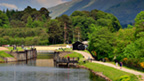 Lock on the Caledonian Canal with mountains behind.