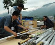 Zahra puts up warehouse tents with Chinese volunteers