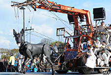 A large dog puppet walking through Liverpool