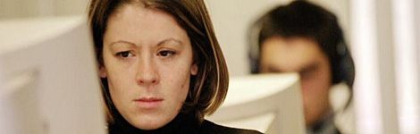 A confused looking girl at a computer