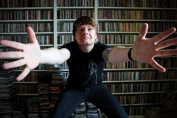 Vic Galloway with a wall of CDs