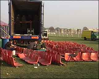 Seating has been unloaded from a lorry ready to be assembled