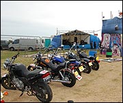 Motorbikes lined up in the field