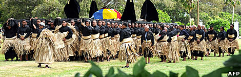 Pall-bearers carry coffin