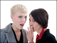 Two women whispering