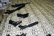 Seized guns and cash