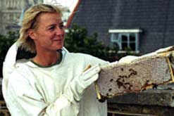 Jill Mead with her hive on the roof of her home overlooking Tower Bridge in London