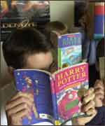 Boys reading Harry Potter