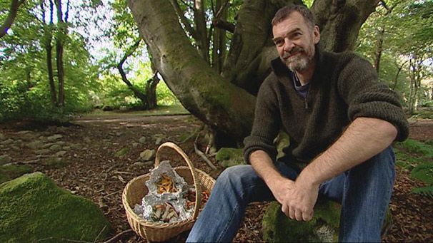 Dr Andy Taylor with a basket of fungi
