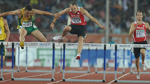 Dai Greene on the way to winning 400m hurdles gold for Wales in Delhi