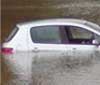 car abandoned on a flood road