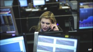 A Portuguese broker talks on the phone in Lisbon