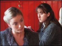 A woman in the foreground who should be watching her back