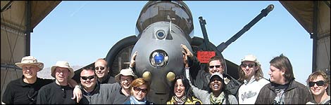 Toby, Terry, the band pose in front of a Harrier