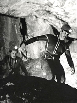 2 cavers explore the Marble Arch Caves