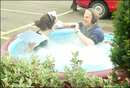 Kat Brown and Howard Bentham in a hot tub