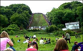 Crowds watch competitors in the cheese-rolling competition