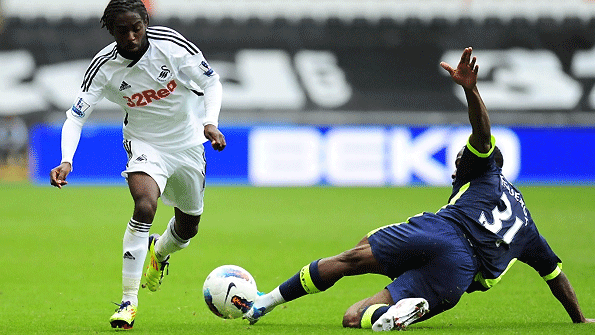Swansea's Nathan Dyer (left) is tackled by Wigan's Maynor Figueroa.