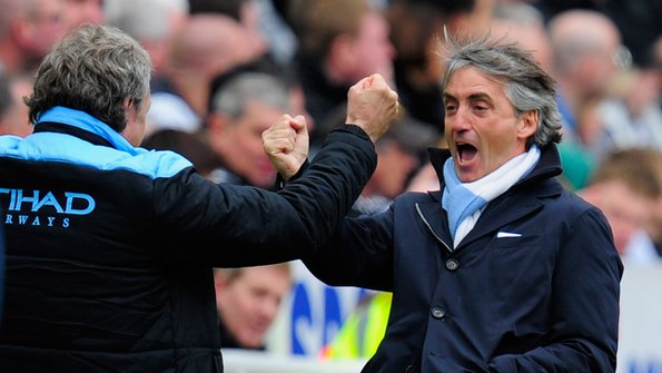 Roberto Mancini celebrates winning at Newcastle