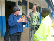 Road Kill presenter Sheena McDonald and producer Kirsten Lass interview a lollipop man in Nairobi, Kenya