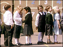 Infant school children playing in the playground