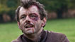 A bloodied and bruised Michael Sheen as Tommy Atkins. Photo © Getty Images