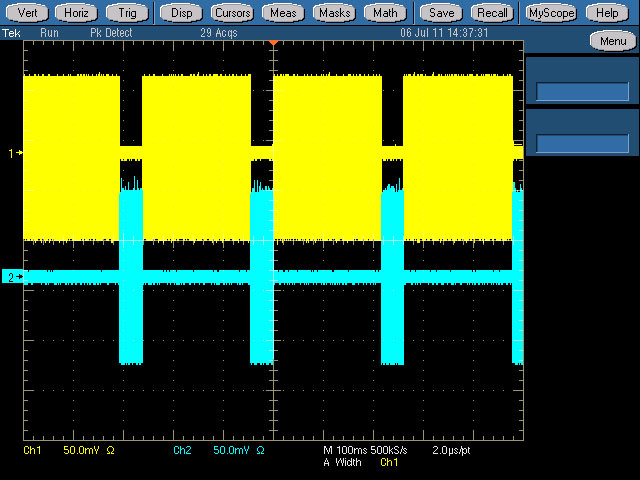 An oscilloscope plot showing how the HD (top trace, in yellow) and mobile (bottom, in blue) services slot together; each sits exactly in the gap left in the other service and are combined inside the modulator to create a single signal.