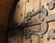 Rusting iron hinge on studden wooden door of Rosslyn Chapel
