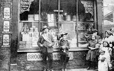 Father and son outside shop