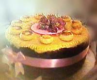 Mothering Sunday Simnel cake with eleven balls of marzipan on top, decorated with Easter chicks