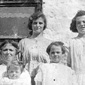 A family photograph taken in 1922. Patricia's mum, Kit, is on the far left handside of the front row. Her aunt Delia is the tall girl beside the window in the back row