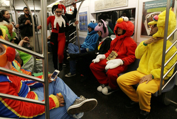 Group of friends travel on subway after Halloween parade in New York