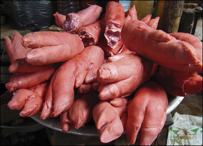 Pigs' trotters for sale in a market, often eaten by locals at the weekend