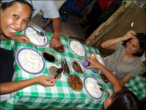 Ben's colleagues sit down to a Filipino feast...