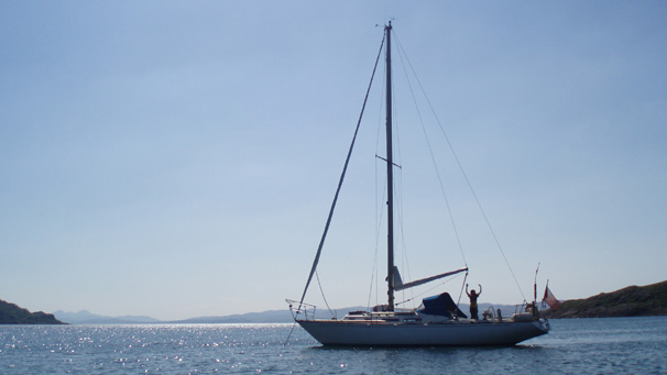 View of a yacht sailing on a sunny day in Scotland
