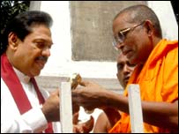 Rajapaksa with JHU leader after signing an electoral pact