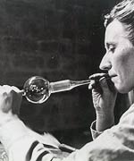 Blowing of glass to shape