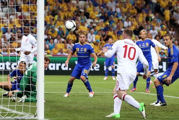 Wayne Rooney move in to score against Ukraine