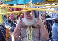 The framework is borne on Carl's head and shoulders while hooks attach to his body