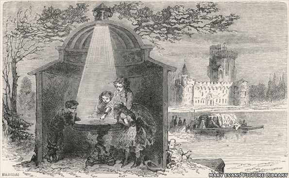 A girl explains to her younger brother and sisters how the camera works, 1874