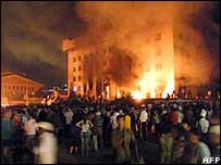 The ruling party headquarters was burnt as protests continued late into the night