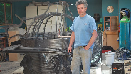 Sebastien Boyesen with the Angel of the Valleys sculpture in progress