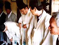 Korean men at a ceremony